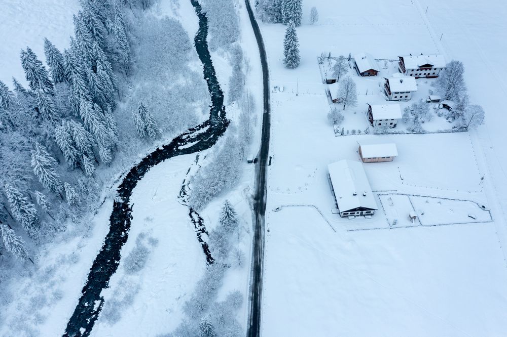 Snow-covered mountain valley, drone aerial view in the Allgau Alps, Germany