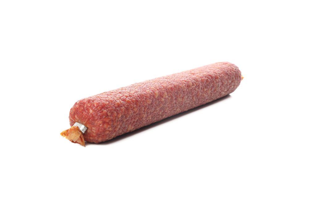 Encased cured meat on blank background