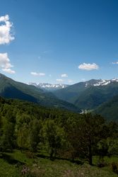 Mountain road winding through green hills
