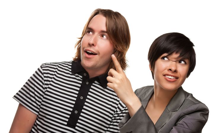 White Male and Multiethnic Female Pointing Up