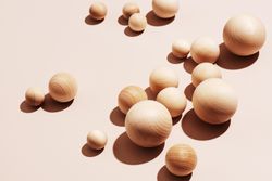 Wooden balls on neutral background
