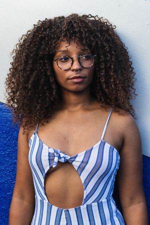 Trendy Black female against bright wall