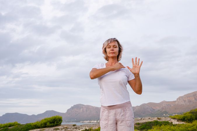 Adult woman doing breathing exercise