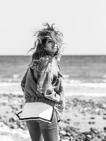 Young woman walking on seashore