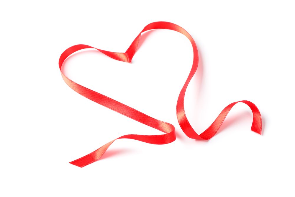 Red ribbon heart isolated on blank background