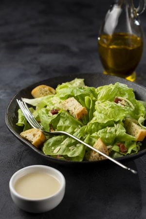 Caesar salad with croutons and bacon.