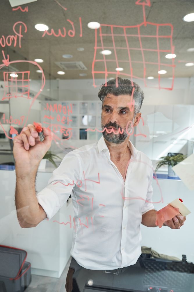 Serious unshaven man creating new mask sample