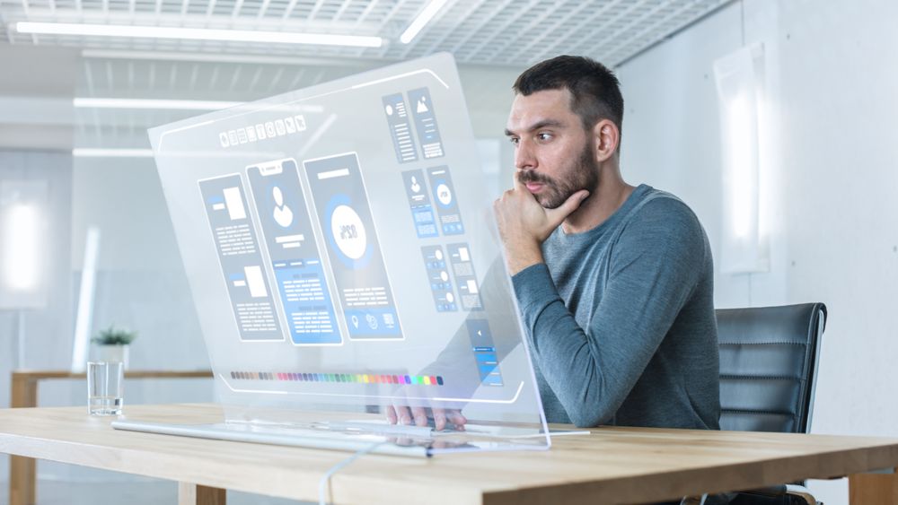 In the Futuristic Laboratory Creative Engineer Works on the Transparent Computer Display.