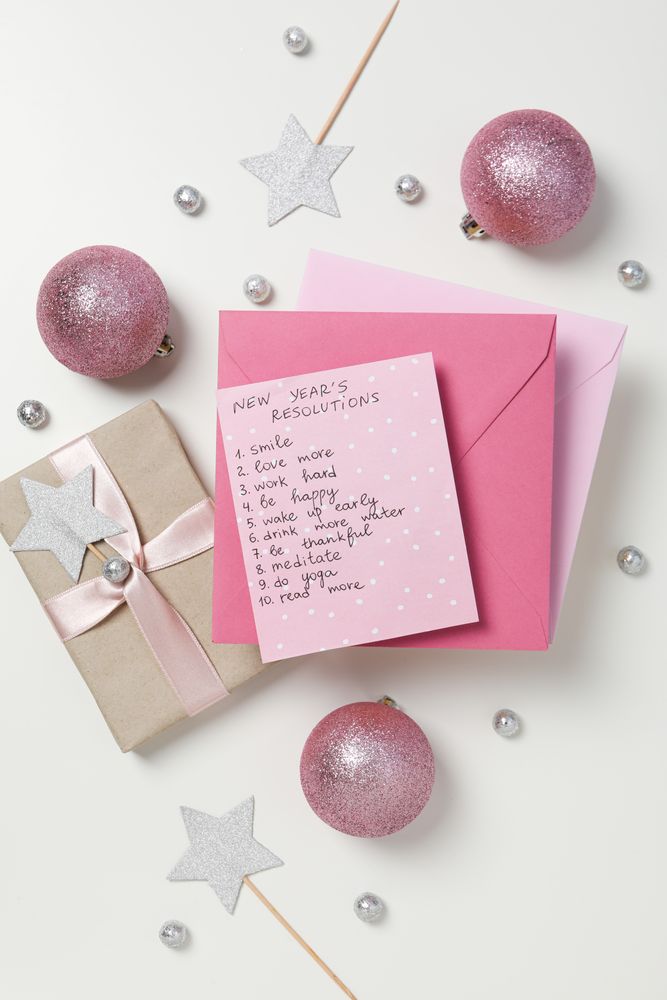 Concept of New Year Resolutions list, new year goals, top view