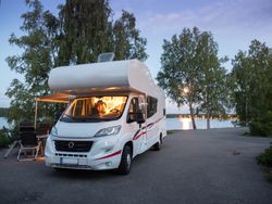 Camper car parking for picnic near lake