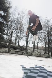 Young man in air dancing break dance in park