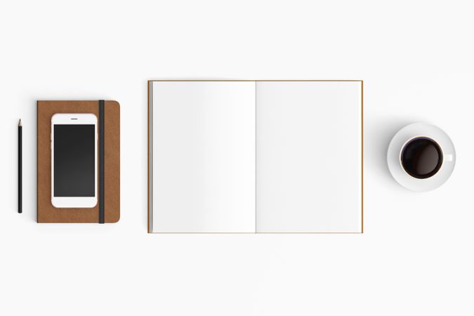 Modern workspace with coffee cup, smartphone, paper, notebook