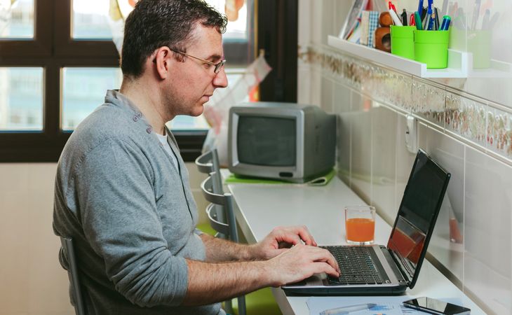 Man working from home with laptop
