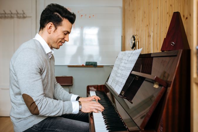 Man playing piano in studio