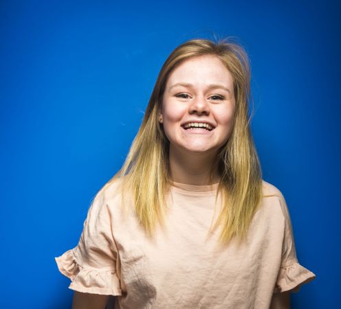 Blonde woman posing in studio