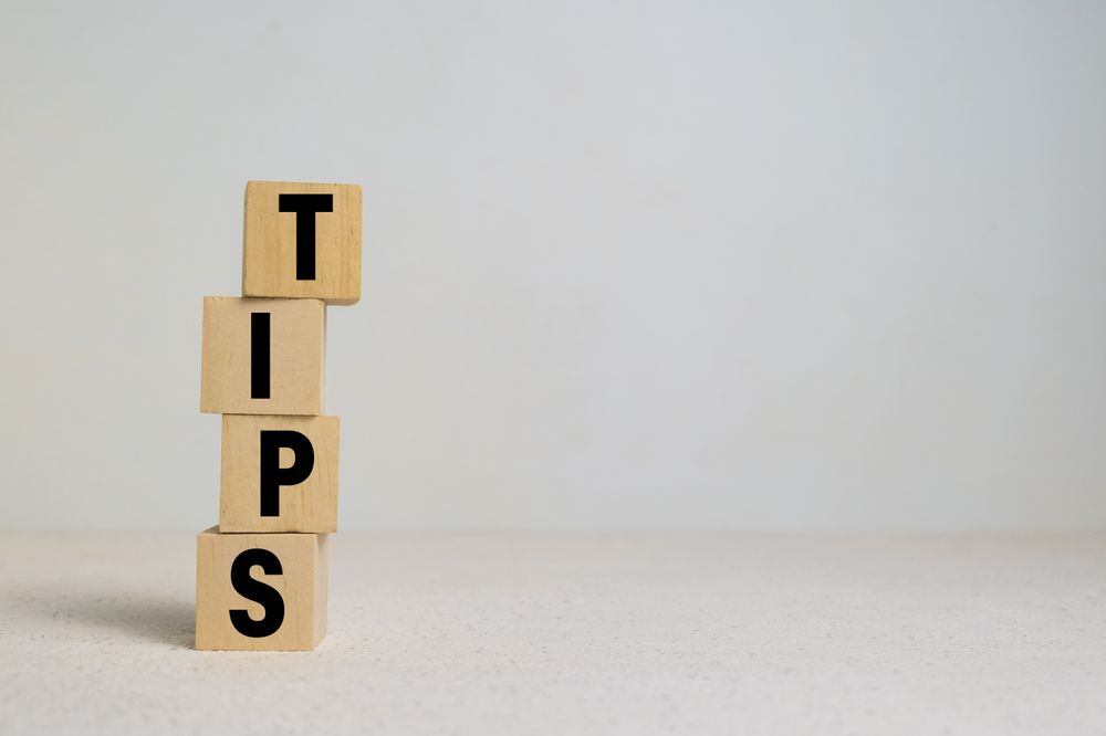 tips word on stack wooden blocks on light background