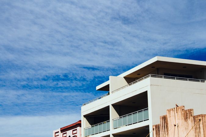 Modern Building With Large Balconies Against A Clear Blue Sky In The City