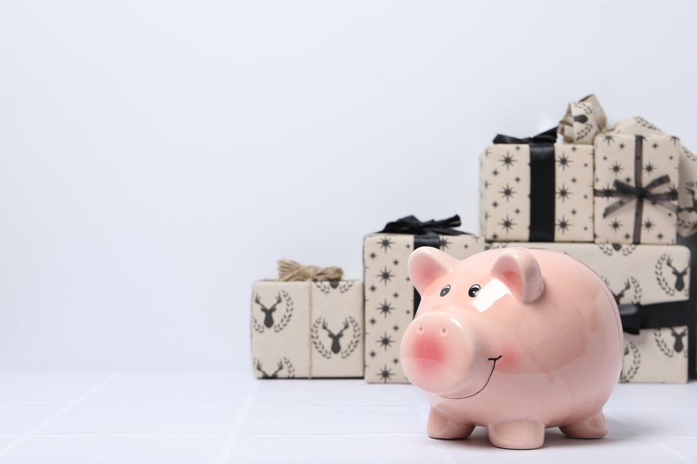 Concept of Christmas finance with piggy bank, space for text