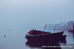 Dinghies on water in fog 5pZYxb