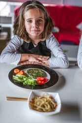 Girl waiting to eat vegan food at home