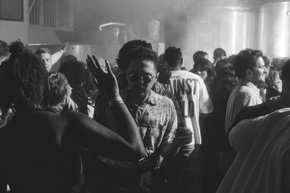 London, England, United Kingdom - Nov 9, 2022: B&W shot of people dancing at Dialled In Fest