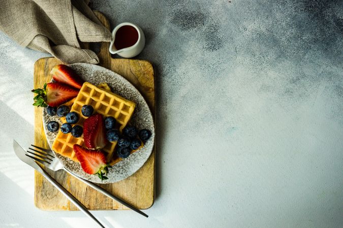 Top view of waffle breakfast with blueberries & strawberries
