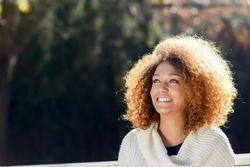Portrait of smiling woman in the sun