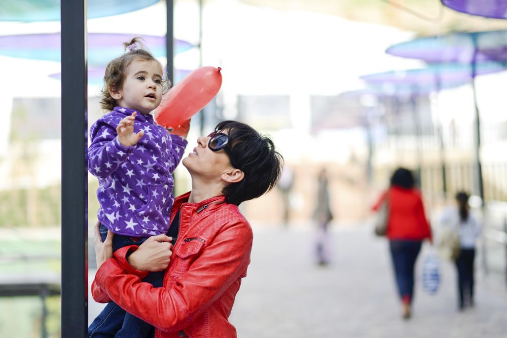 Woman and her cute little daughter having fun