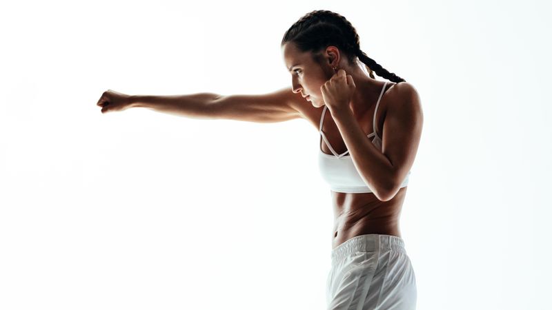 Fitness woman practicing boxing exercise