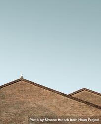 Roofs of two buildings against a blue sky 4dBqr0