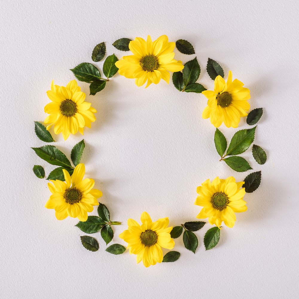 Round wreath with yellow flowers and leaves