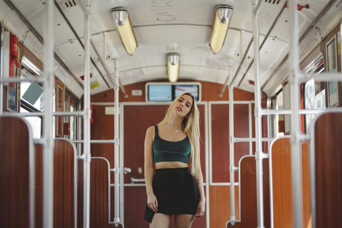 Woman posing in train car