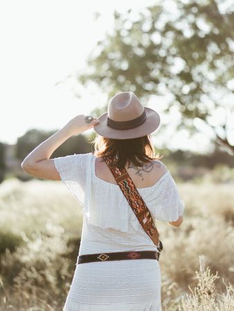 Charming smiling woman with trendy accessories outdoors