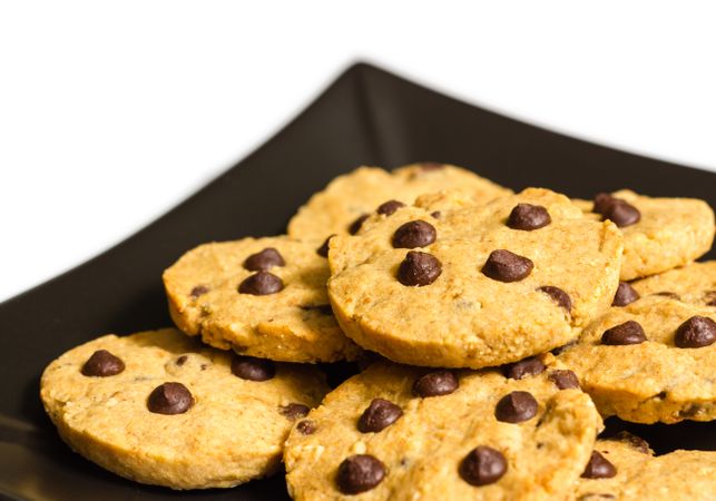 Chocolate chip cookies on a plate isolated on light background