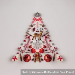 Christmas tree made of Christmas decorations on light background 5opBy4
