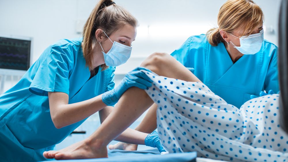 In the Hospital Close-up Shot of Professional Midwife Assisted by Obstetrician
