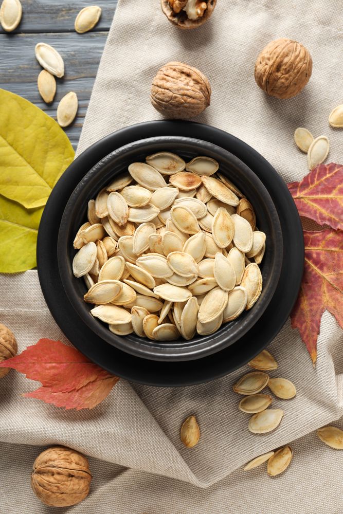 Fall season food - pumpkin seeds, top view