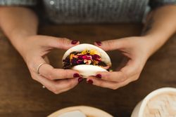 Woman holding Asian snack food