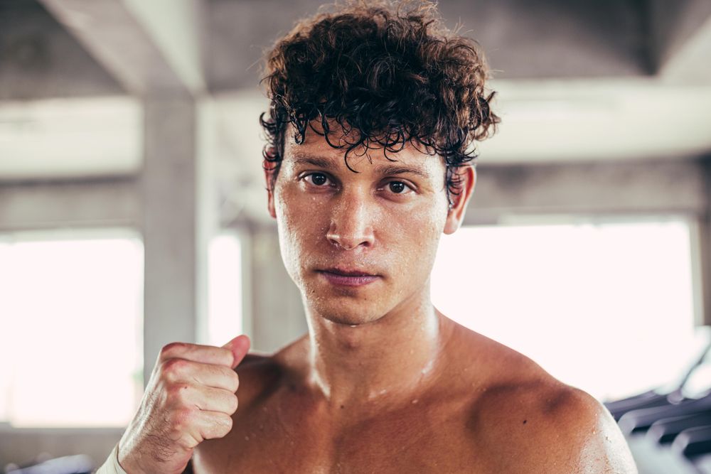 Portrait of boxer standing guard position ready to fight