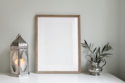 Moroccan lantern with olive tree branches in silver jug with mock up picture frame