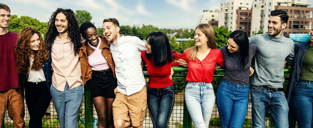 Multiracial young adults sharing a laugh in a city park