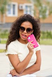 Portrait of Black female with phone