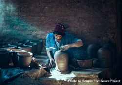 Man making pottery indoor 47zjl5