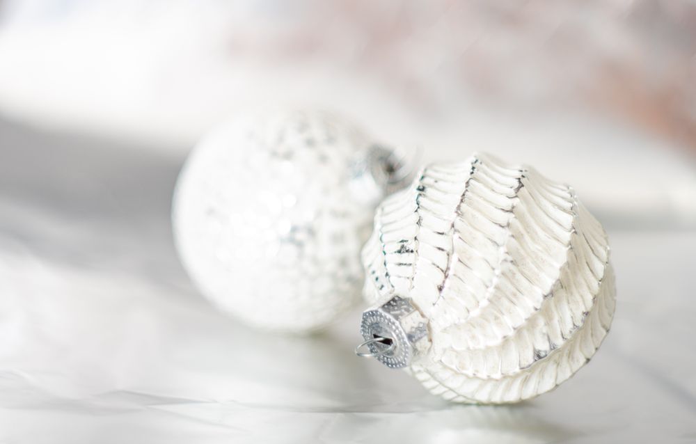 Christmas holiday baubles on light background