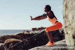 Woman runner doing stretching exercises 0JKQv5