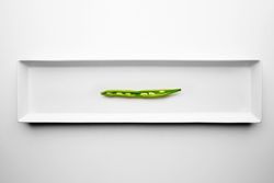 Halved green bean on appetizer plate
