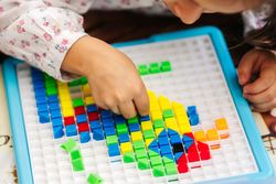 Box with colorful pieces for board game