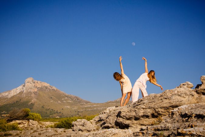 Young women posing on stones