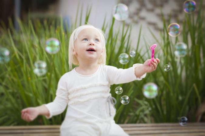 Adorable Little Girl Having Fun With Bubbles