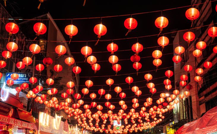 Red lit lanterns decorating the alley of Bangkok, Thailand at night